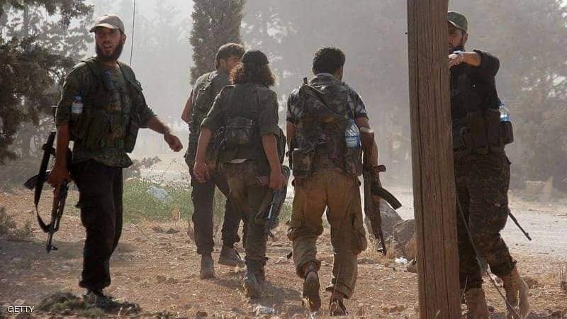 عناصر من جبهة النصرة الموالية للقاعدة في سوريا وتقرير يفضح دعم تركيا