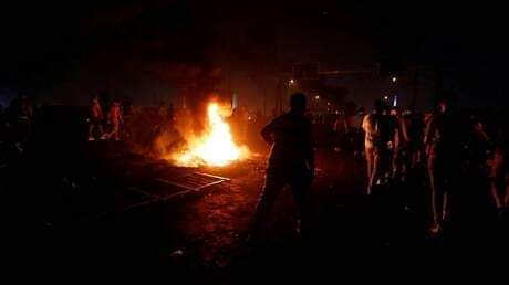 مقتل 12 متظاهرا حرقا أثناء دخولهم لمقرات حزبية في العراق .